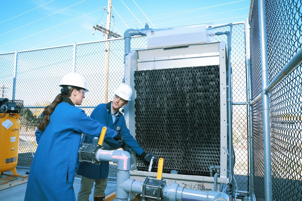 Two employees at Travertine Facilities outside