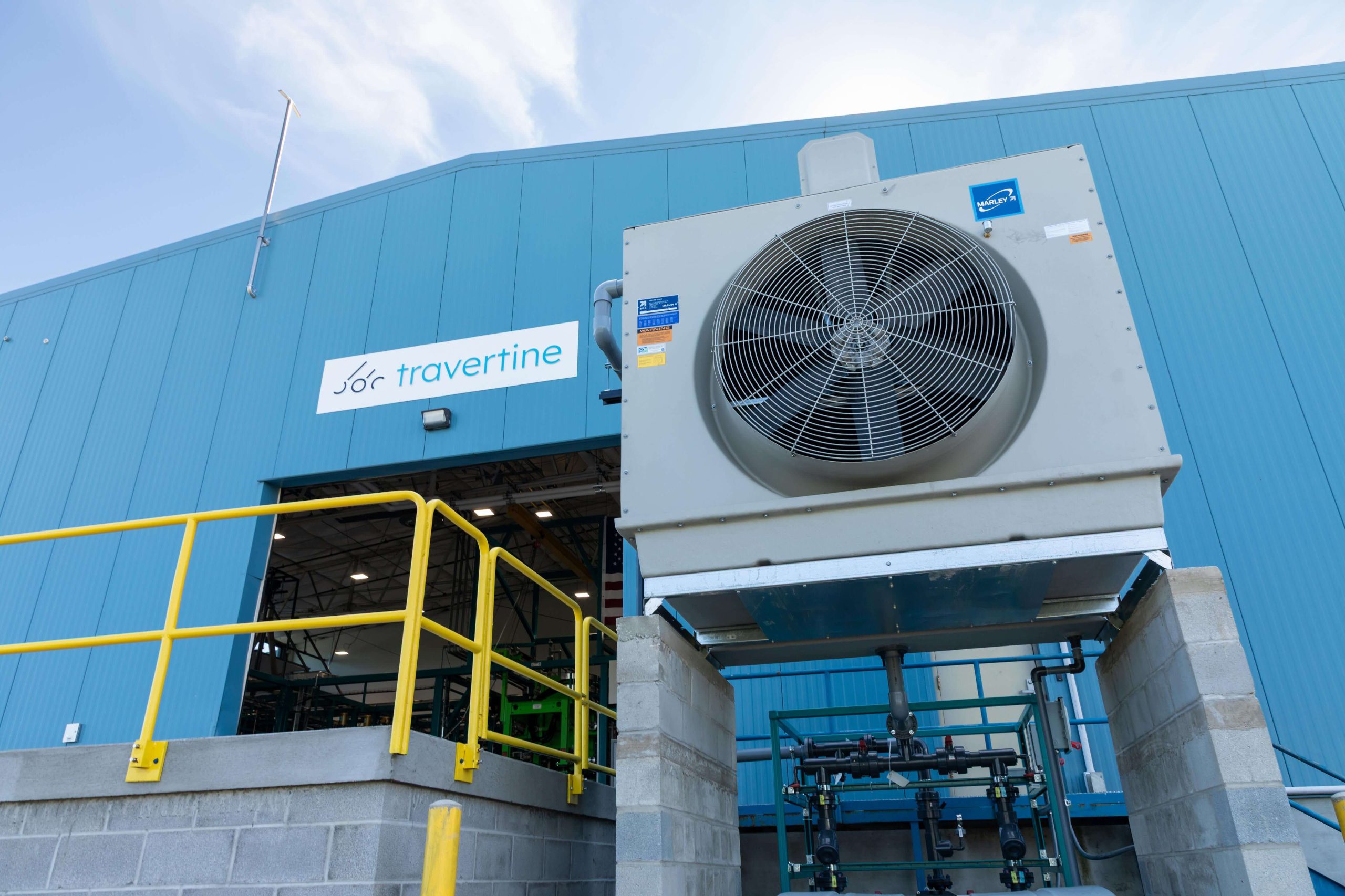 Exterior of Travertine facility with Travertine Logo