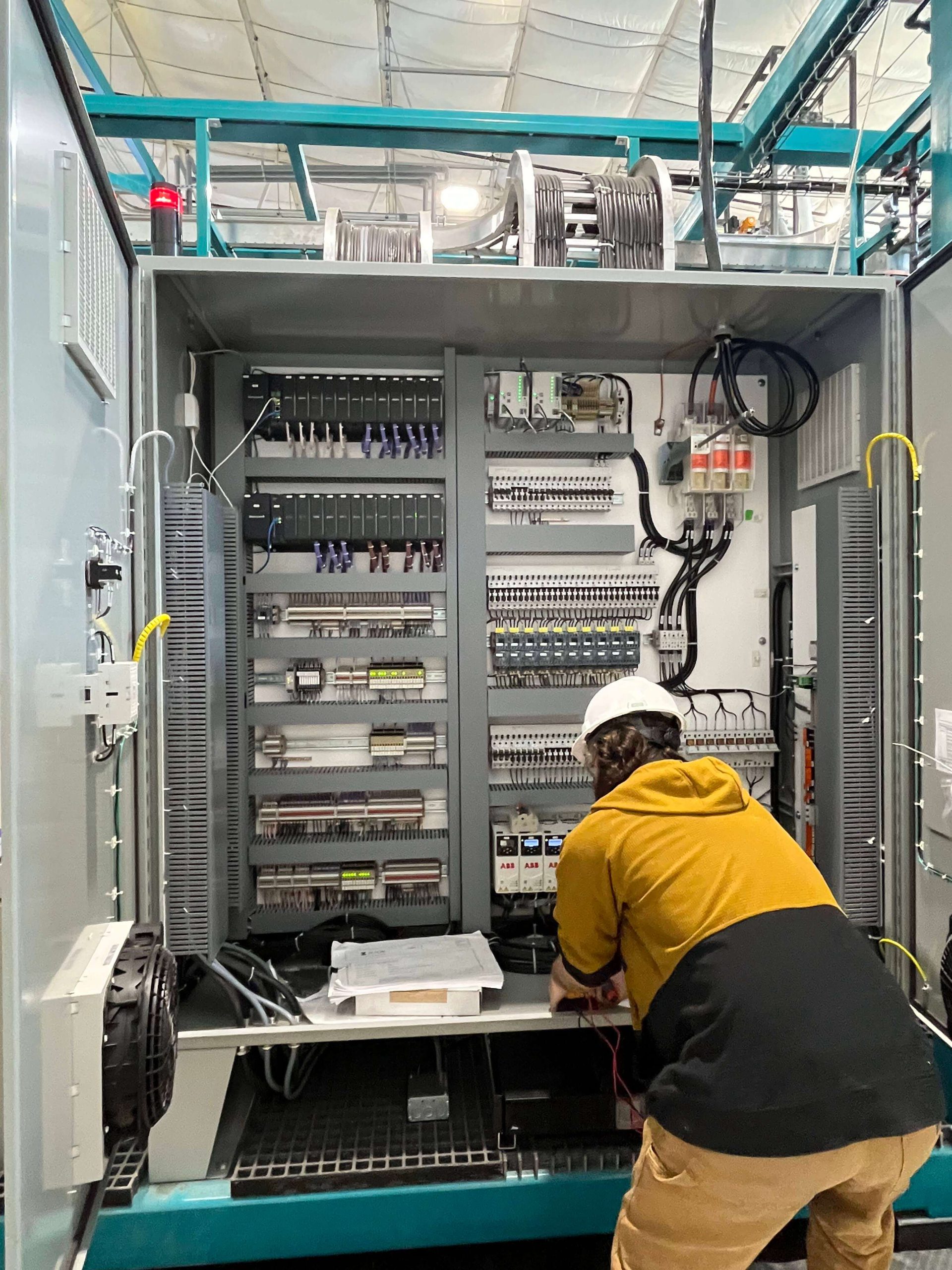 Employee setting up Demonstration plant