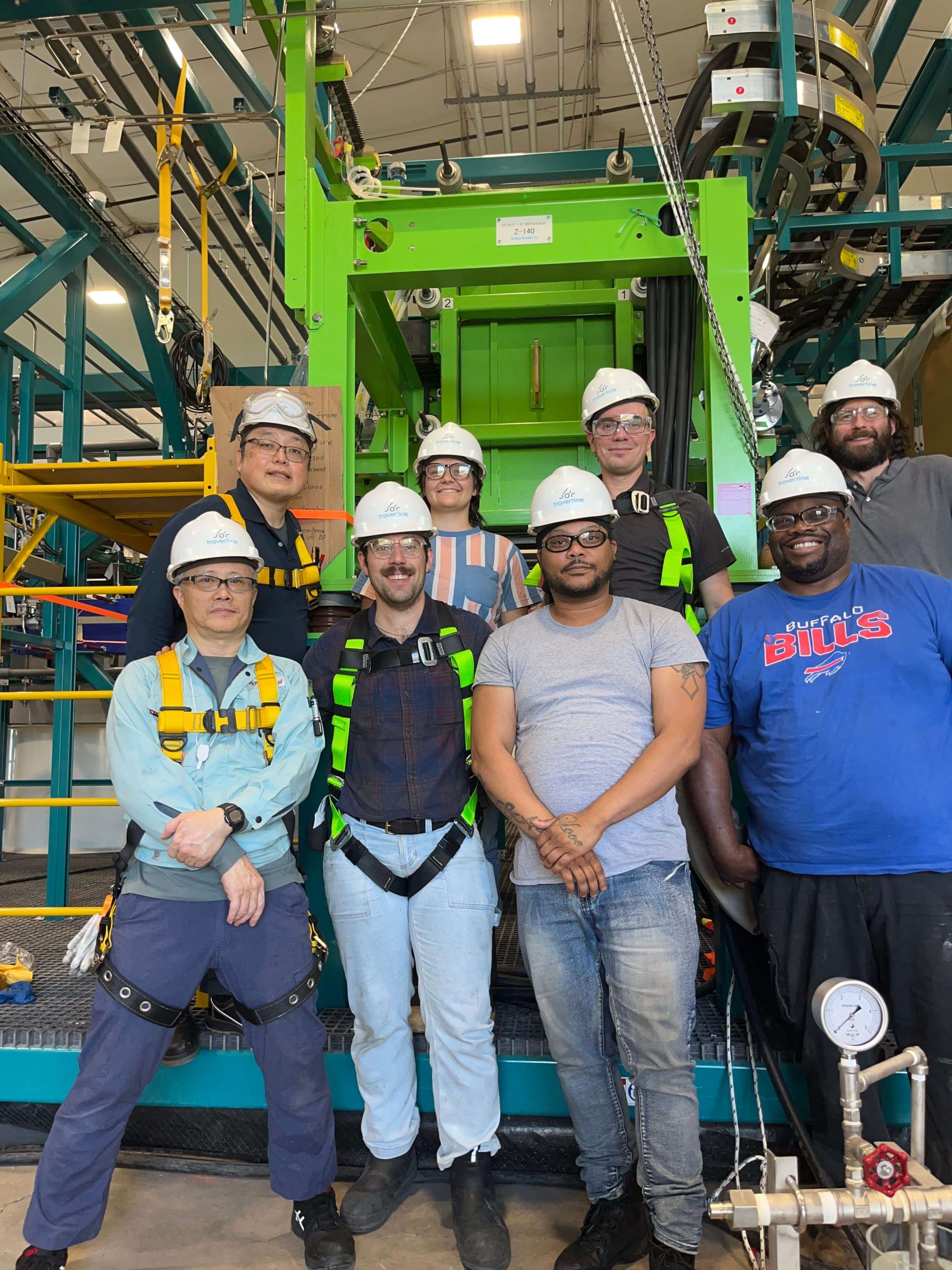 Group of employees who set up plant