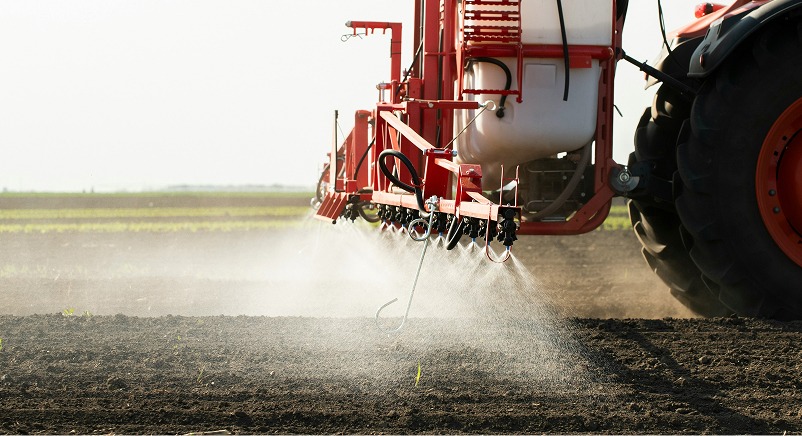 A tractor applying liquid fertilizer
